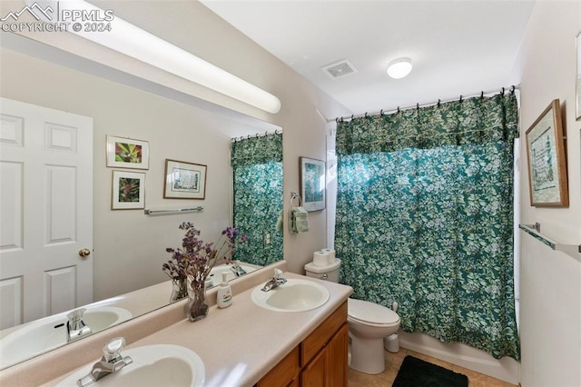 full bathroom with tile patterned flooring, vanity, toilet, and shower / tub combo