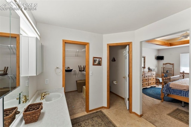 bathroom with ceiling fan and sink