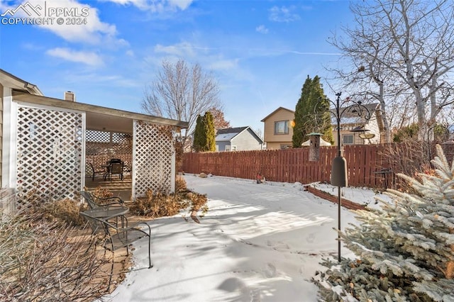 view of snow covered patio