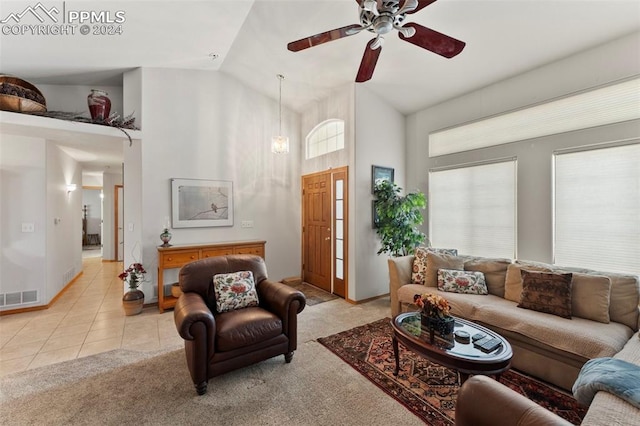 tiled living room featuring ceiling fan