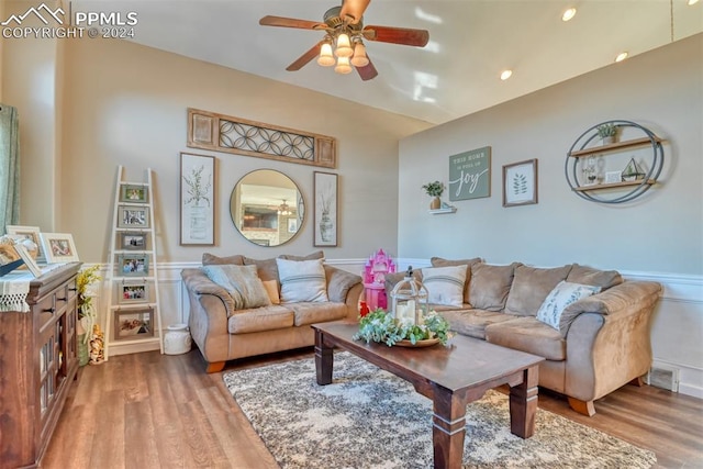 living room with ceiling fan and wood-type flooring