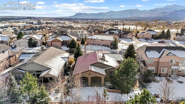 birds eye view of property with a mountain view