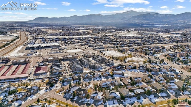 birds eye view of property featuring a mountain view