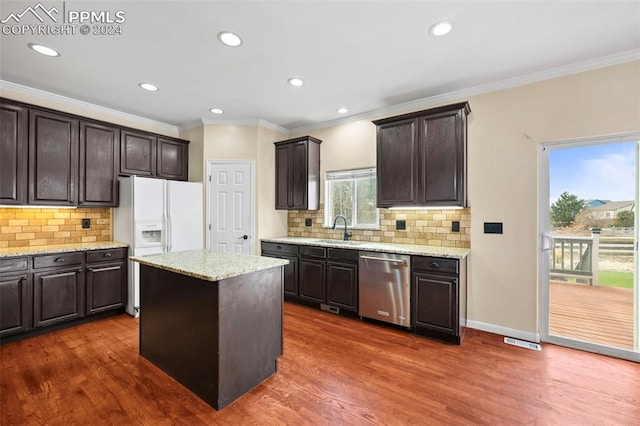 kitchen featuring stainless steel dishwasher, a center island, dark hardwood / wood-style flooring, and sink