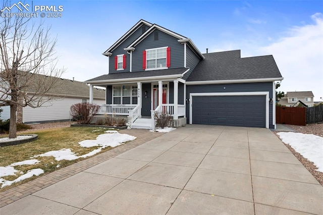 view of front of home featuring covered porch and a garage