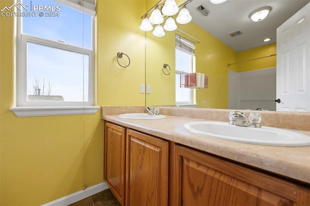 bathroom featuring tile patterned floors and vanity