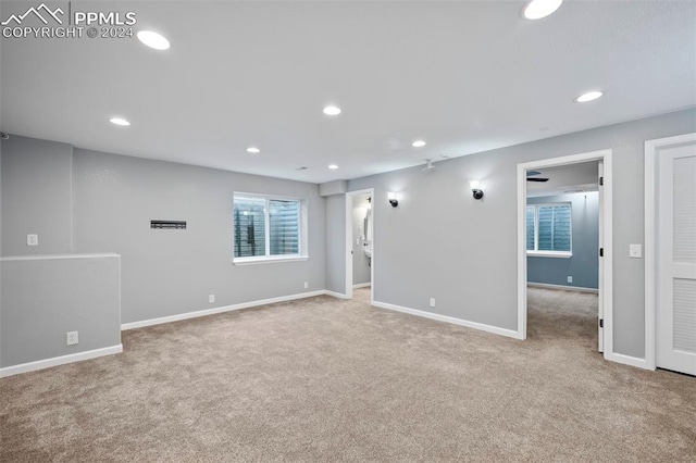 empty room with light colored carpet