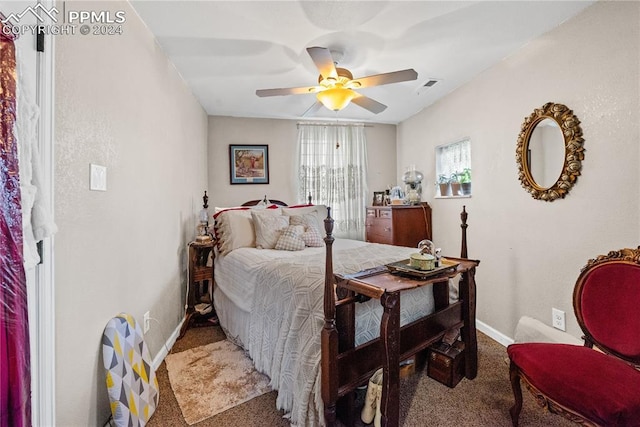 bedroom with ceiling fan and carpet floors