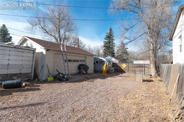 view of yard with an outbuilding and a garage