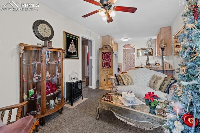 living room with carpet flooring and ceiling fan