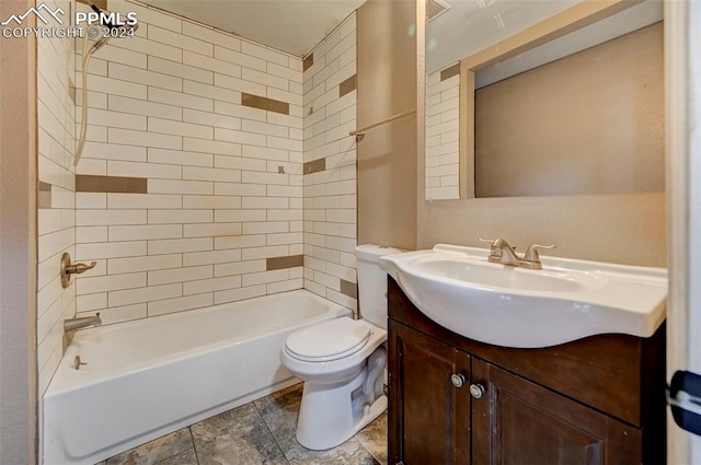 full bathroom with vanity, toilet, and tiled shower / bath