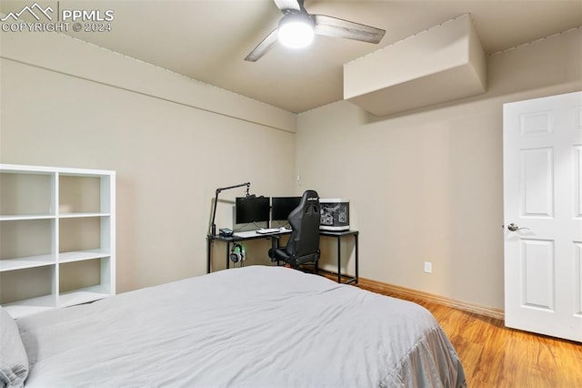 bedroom with ceiling fan and wood-type flooring