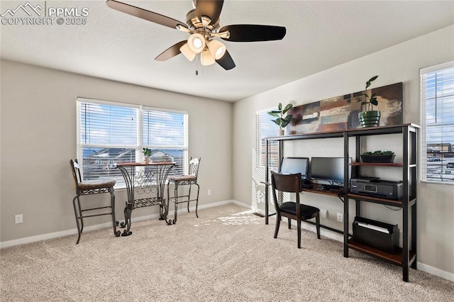 office space with ceiling fan and light colored carpet