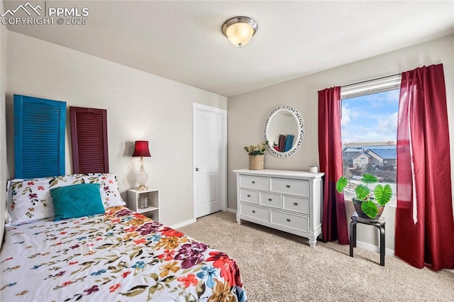 bedroom featuring light carpet