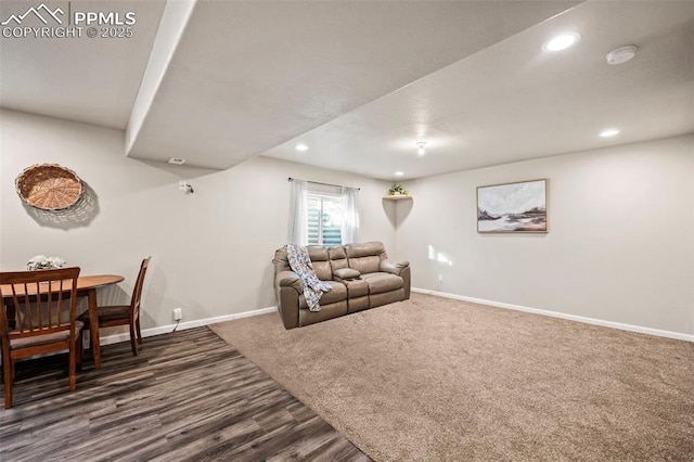 living room with dark hardwood / wood-style flooring