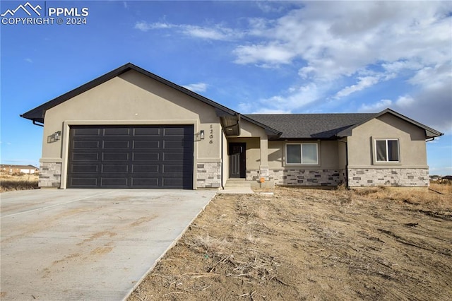 ranch-style house featuring a garage