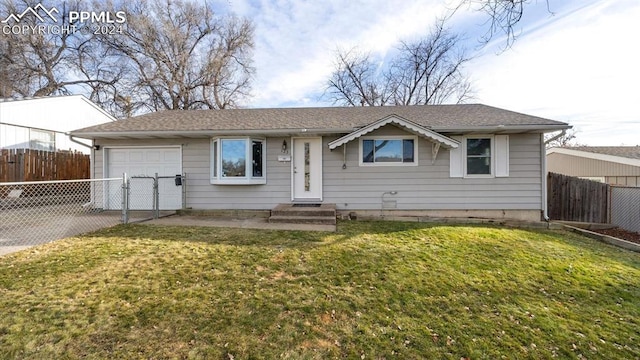 ranch-style house with a garage and a front lawn