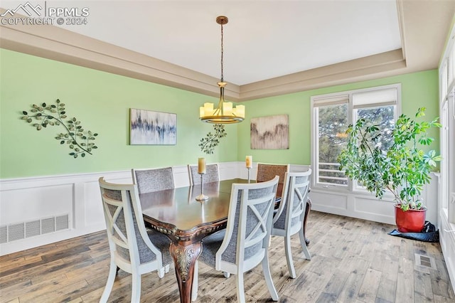 dining area with a chandelier and hardwood / wood-style floors