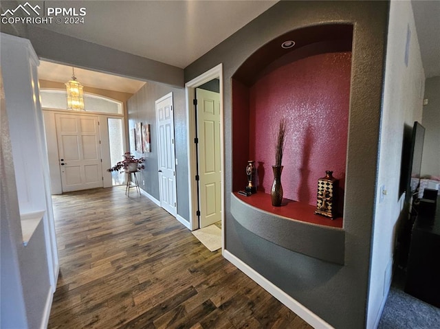 hall with wood-type flooring