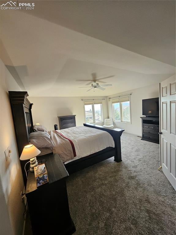 bedroom with carpet, ceiling fan, and lofted ceiling