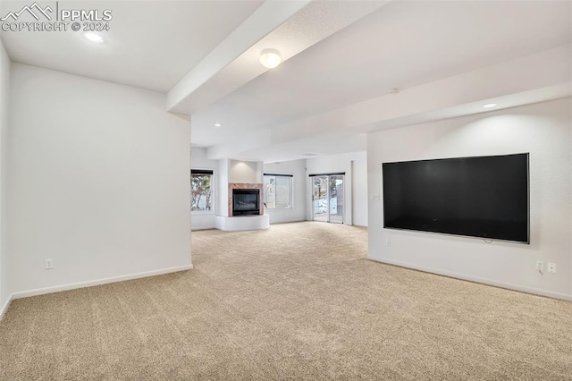 unfurnished living room with carpet