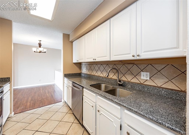 kitchen featuring white cabinetry, sink, and stainless steel appliances