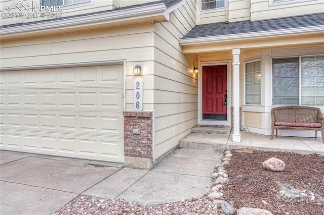 view of exterior entry featuring a garage