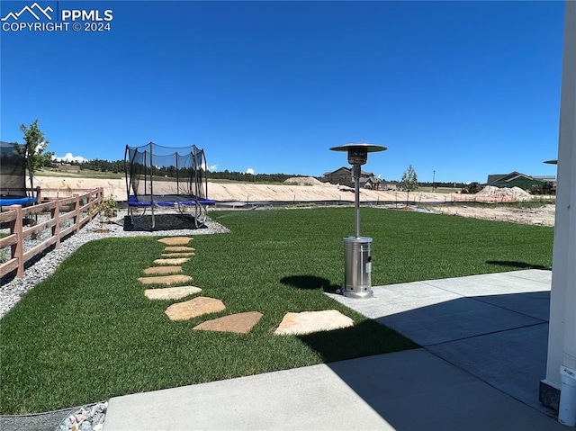 view of yard with a patio area and a trampoline