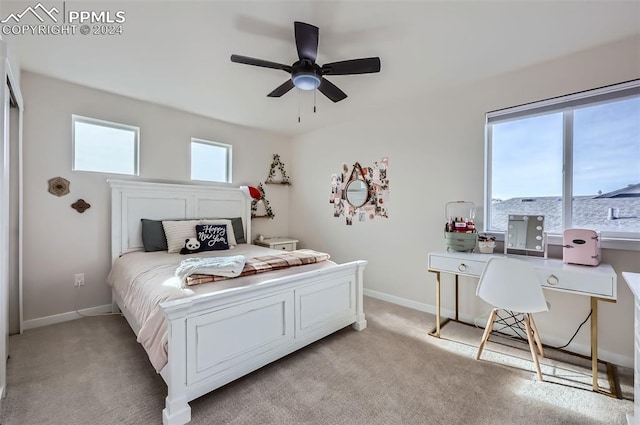 bedroom featuring light carpet and ceiling fan