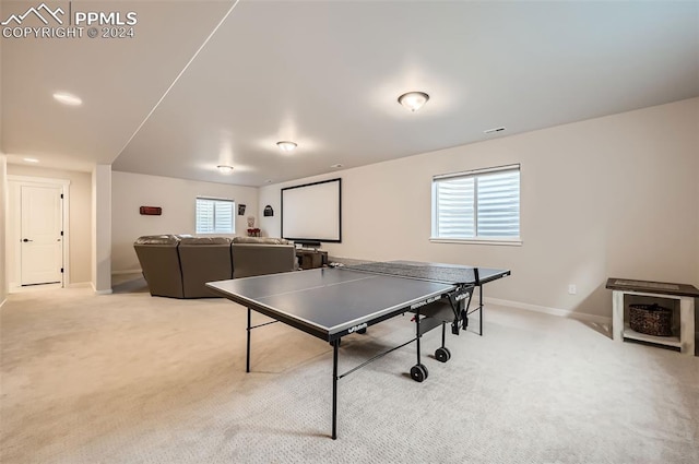 game room with light colored carpet and a healthy amount of sunlight