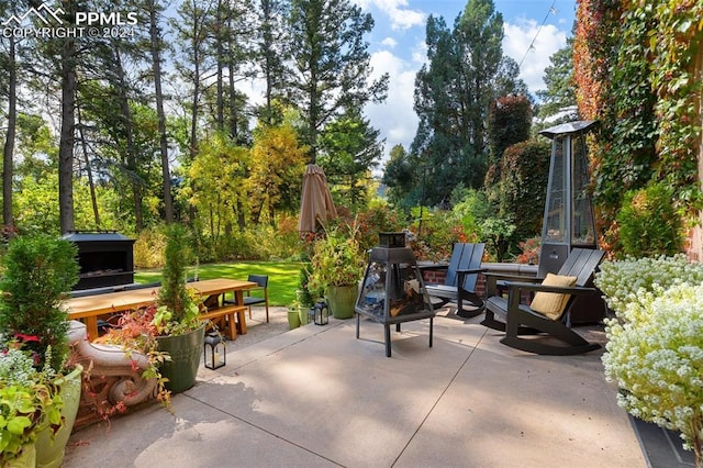 view of patio / terrace with a fire pit