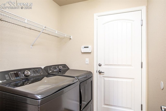 laundry room with washer and dryer