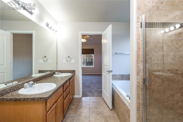 bathroom featuring ceiling fan, tile patterned flooring, vanity, and shower with separate bathtub