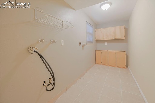 washroom with light tile patterned floors