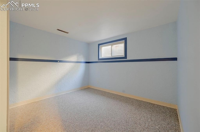 unfurnished room with carpet flooring