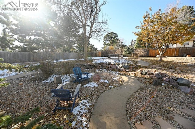 view of yard with an outdoor fire pit