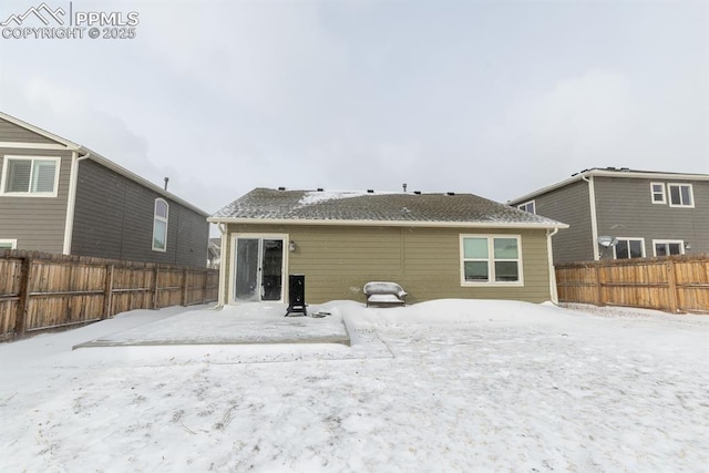 view of snow covered house