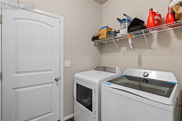 washroom with washing machine and clothes dryer