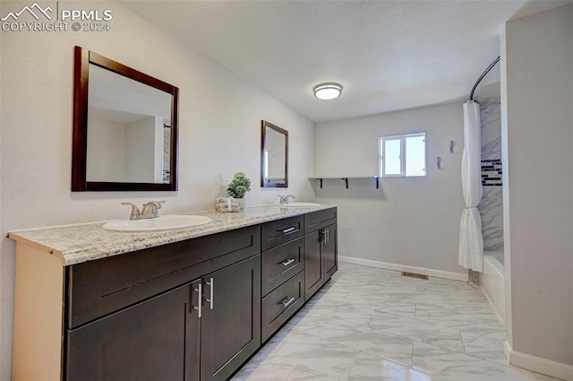 bathroom featuring vanity and shower / bath combo