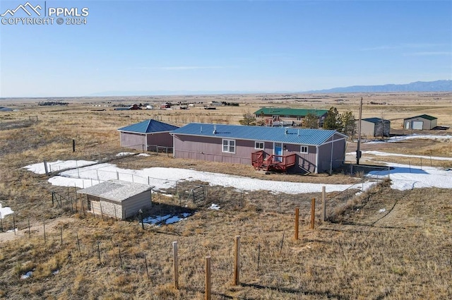 bird's eye view featuring a rural view and a mountain view