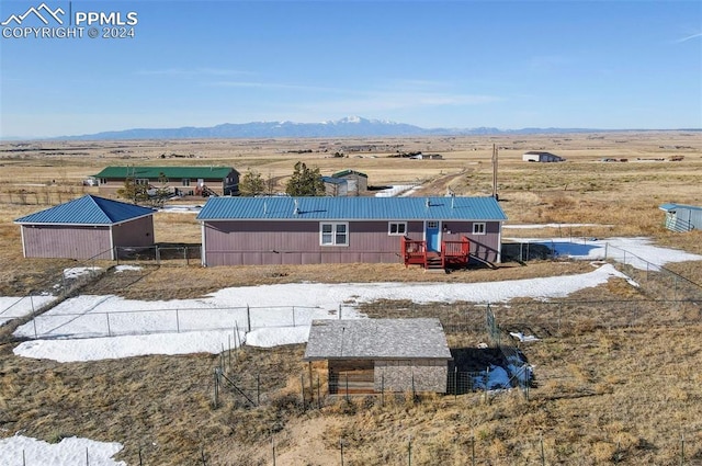 birds eye view of property featuring a mountain view