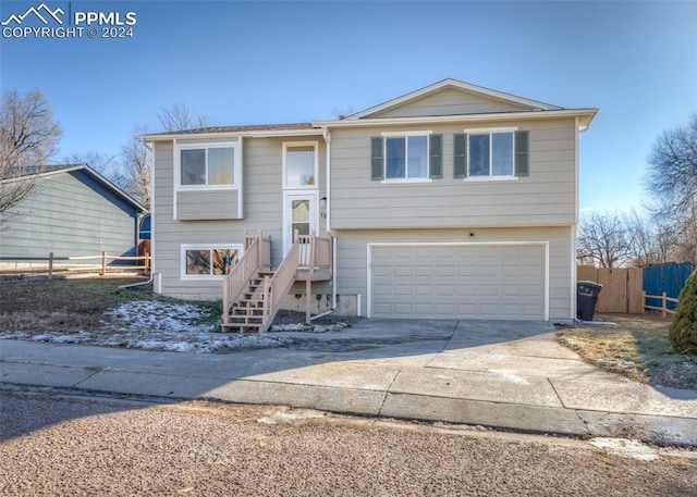 split foyer home featuring a garage