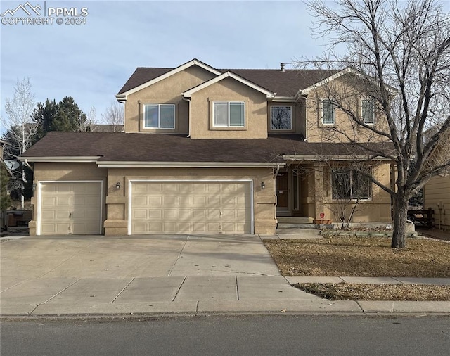 view of front of property with a garage