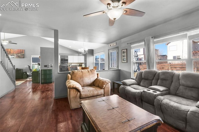 living room with dark hardwood / wood-style flooring, ceiling fan with notable chandelier, and lofted ceiling