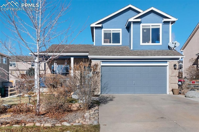 view of front of property with a garage