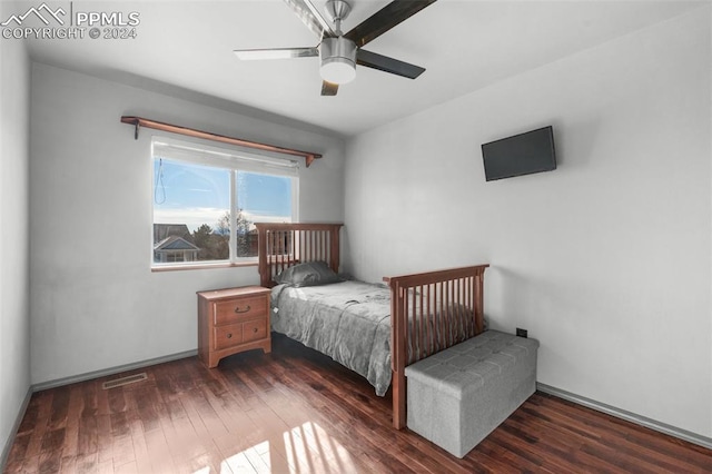 bedroom featuring ceiling fan and dark hardwood / wood-style floors