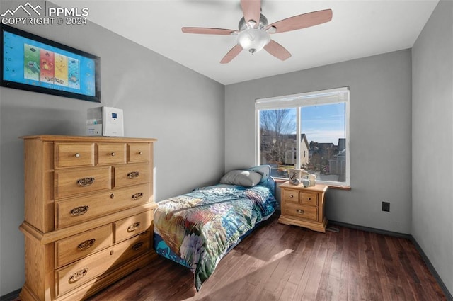 bedroom featuring ceiling fan and dark hardwood / wood-style flooring