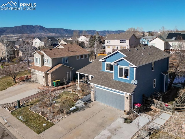 drone / aerial view featuring a mountain view