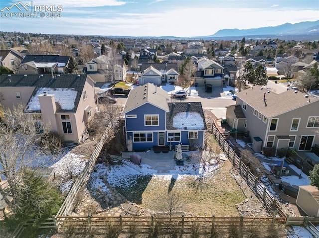 birds eye view of property with a mountain view