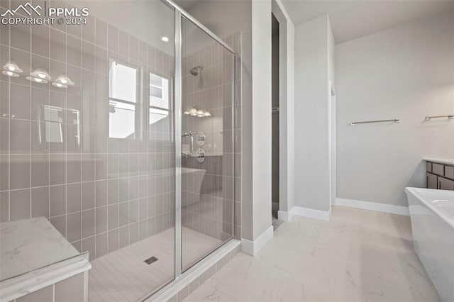 bathroom featuring shower with separate bathtub